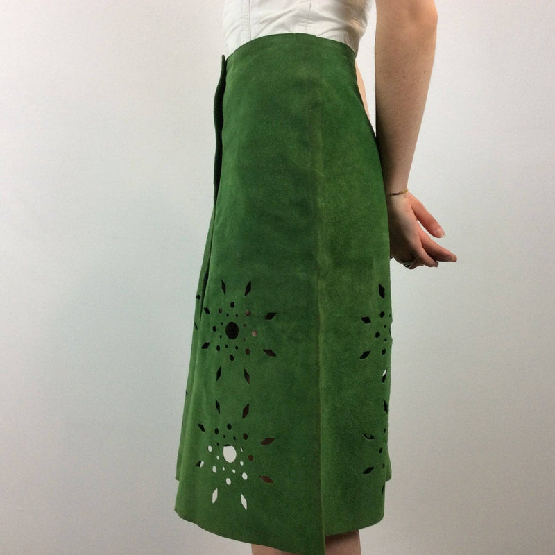 Side view of 1970s Cut Out Green Suede Skirt sold by bohemevintage.com Montréal