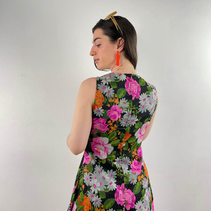 Back view of 1970s Floral Print Flared Maxi Dress size Small/Medium sold at bohemevintage.com Montreal