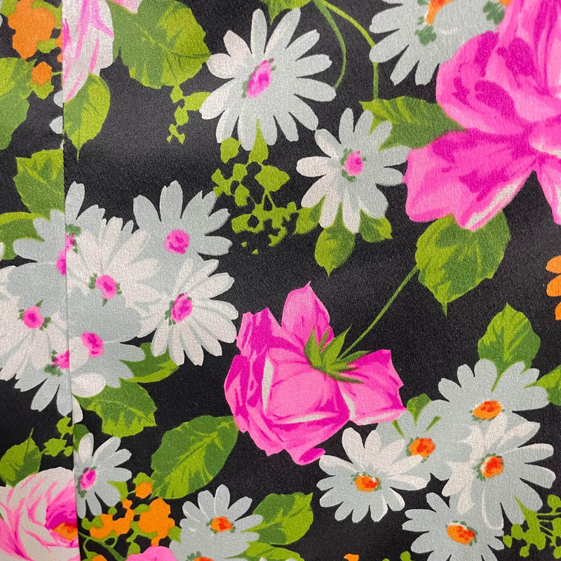 Close up view of fabric of 1970s Floral Print Flared Maxi Dress size Small/Medium sold at bohemevintage.com Montreal