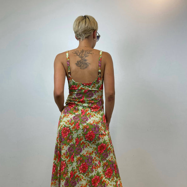 Back view of 1970s Floral Print , Fit and Flare, Bold Floral Print, lightweight synthetic fabric, size small, thin straps, empire waist, Maxi Summer Dress, sold by bohemevintage.com Montréal