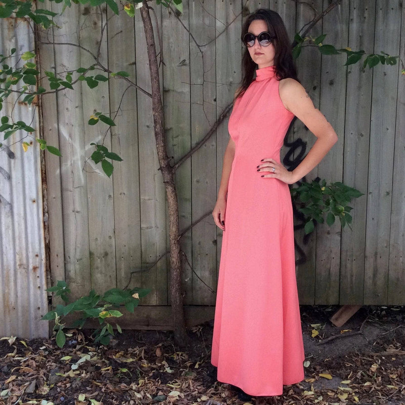 Side view of 1970s Handmade Coral Pink Floor-Length Sleeveless Gown Size small-Medium sold at bohemevintage.com MontreaL