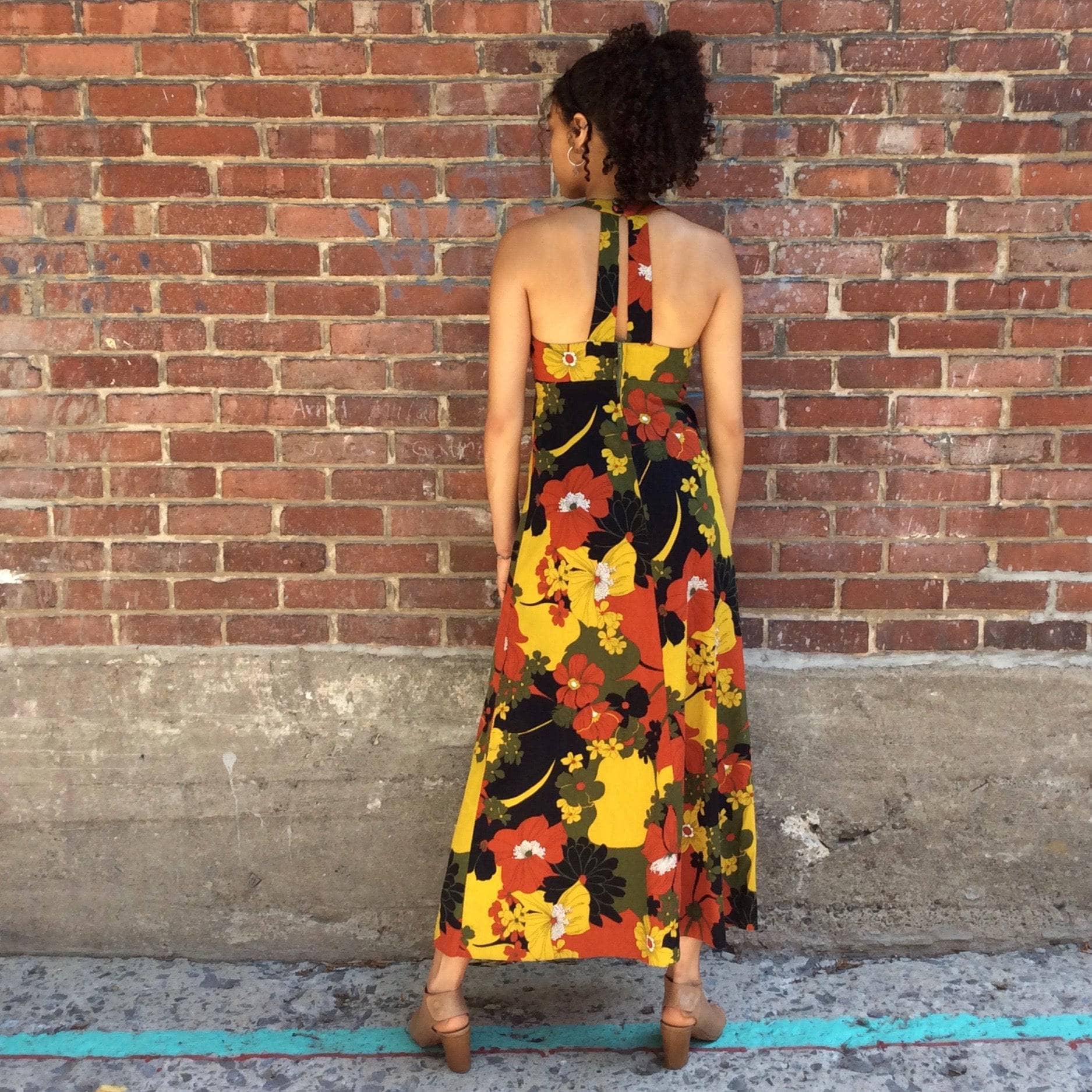 Back view of 1970s Bold floral Hawaiian print Halter top, empire waist maxi dress Sold by bohemevintage.com