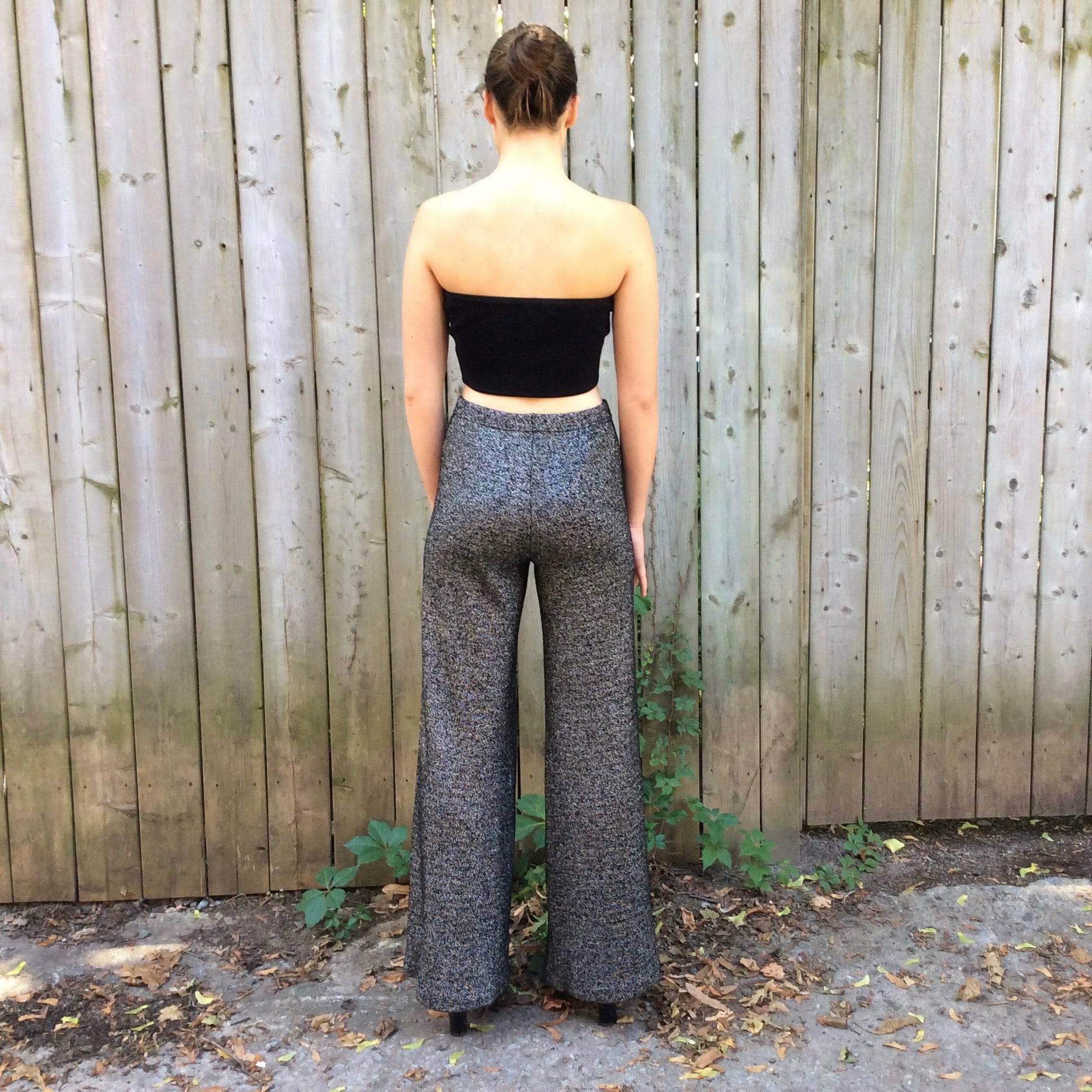 Back view of 1970s High Waisted Silver Knit Wide-leg Pants Size Small/Medium, sold by bohemevintage.com Montréal