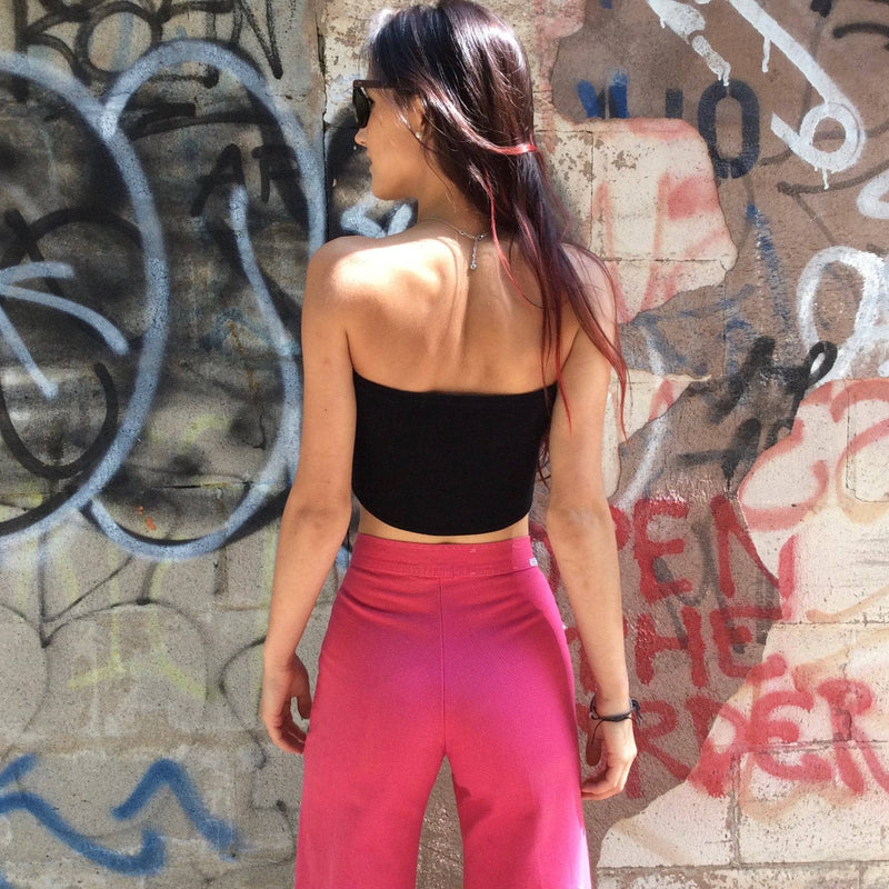 Back View of 1970s High-Waisted Wide-Leg Hot Pink Jeans, sold by bohemevintage.com Montréal