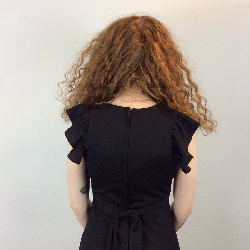 Back view of 1970s Joseph Ribkoff Black Polyester Maxi Dress Size Small sold by bohemevintage.com