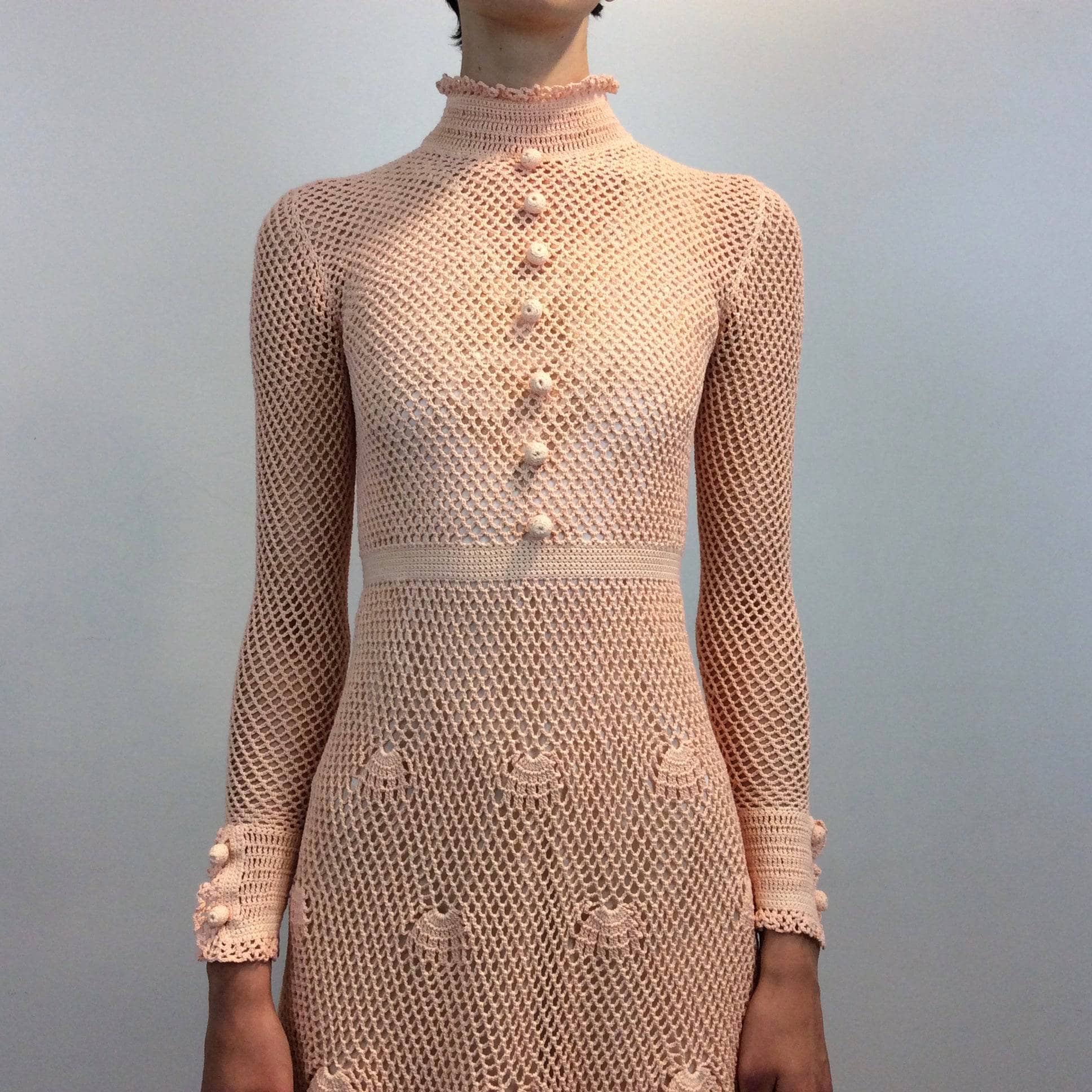 Close-up view of 1970s Long Sleeve Crochet Mesh Midi Dress Size Small sold by bohemevintage.com Montreal