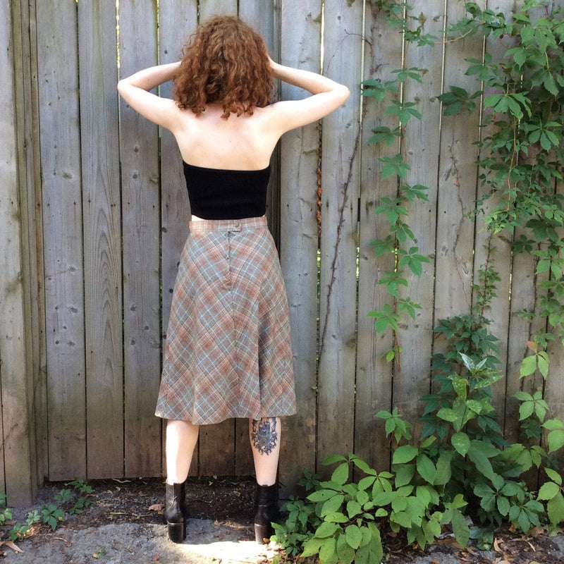 Back view of 1970s Plaid A-line Wool Skirt Size small sold by bohemevintaage.com