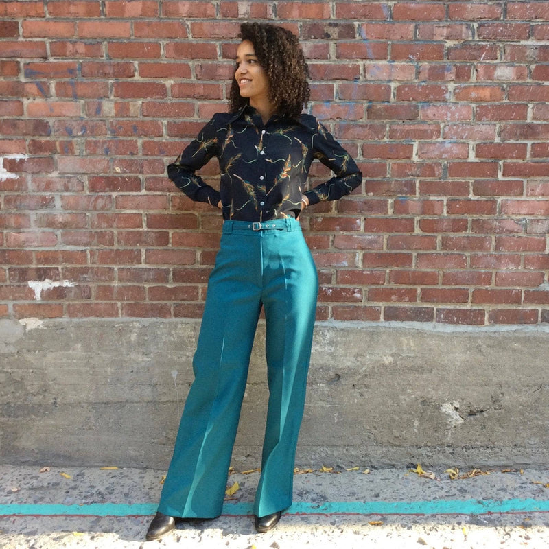 1970s Teal High Waisted Wide Leg Pants size Medium worn with 1970s feather print long sleeve shirt sold by bohemevintage.com Montreal