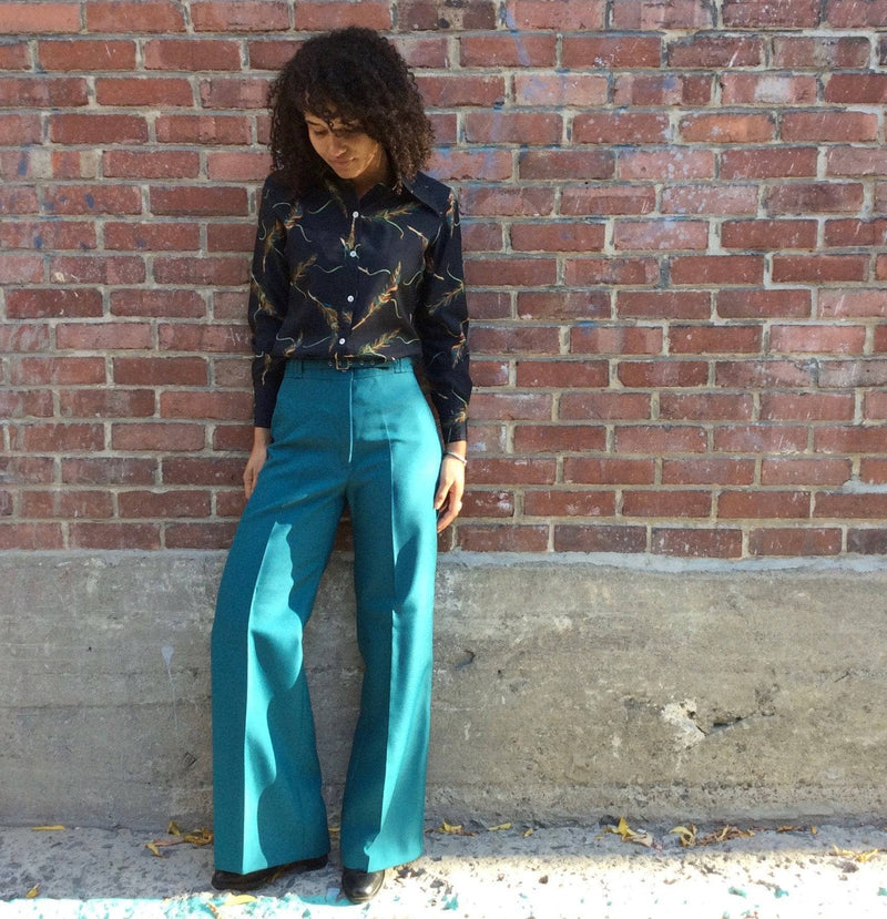  1970s Teal High Waisted Wide Leg Pants size Medium worn with 1970s feather print long sleeve shirt sold by bohemevintage.com Montreal