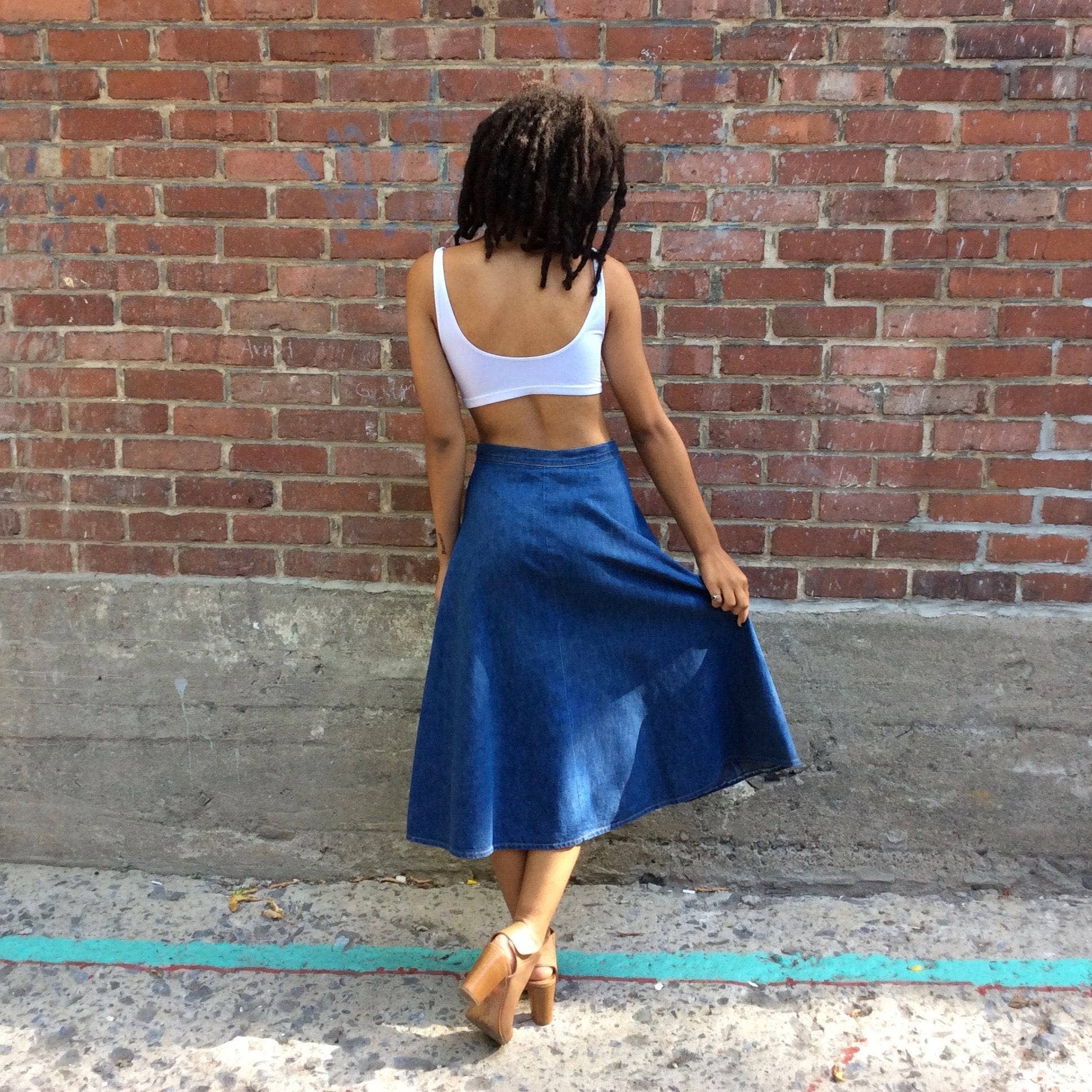 Back view 1970s Midi Length Button-up Jean Skirt by brand UFO sold by bohemevintage.com Montreal