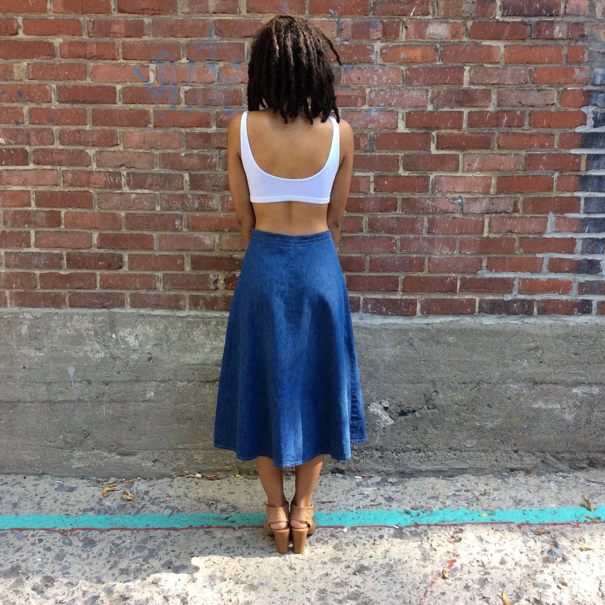 Back view 1970s Midi Length Button-up Jean Skirt by brand UFO sold by bohemevintage.com Montreal