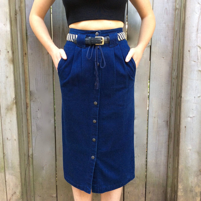 Front View of 1980-90s High-Waisted Midi length Dark wash Denim Skirt Size Small sold at bohemevintage.com Montreal