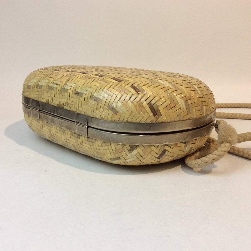 Bottom view of 1980s-1990s Oval Shape Hard Shell Woven Straw Shoulder Bag sold by bohemevintage.com Montreal