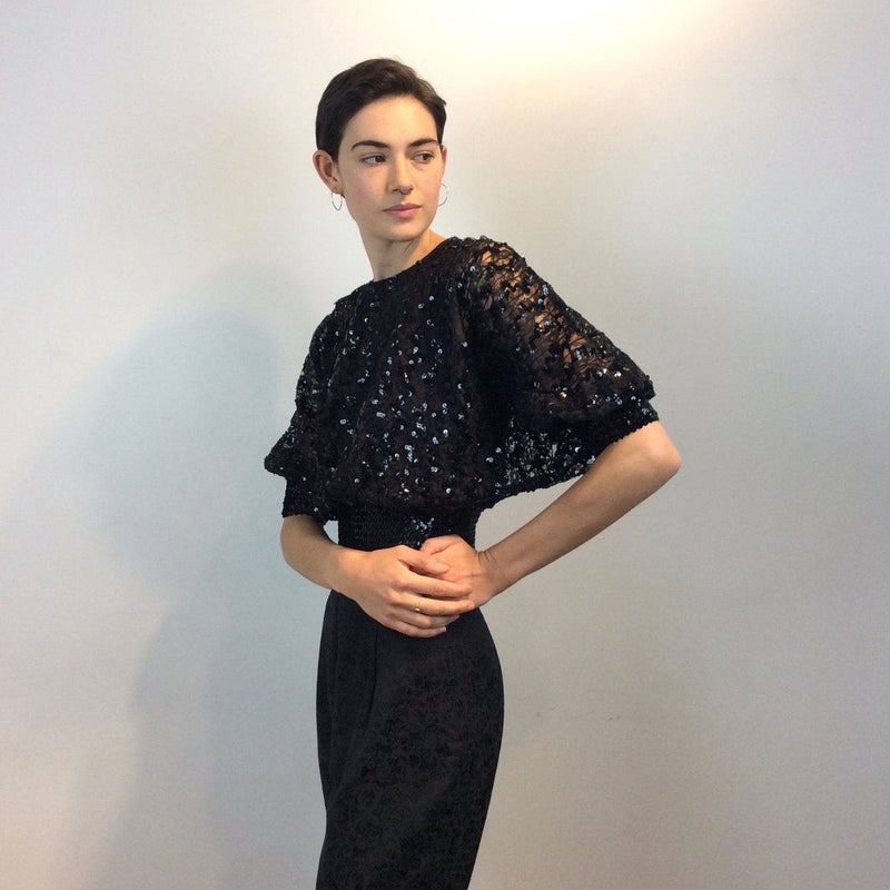 Side view 1980s Batwing Sleeve Lace and Sequin Black Top Size small-Medium sold by bohemevintage.com Montreal
