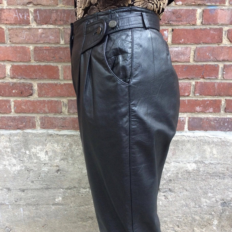 Side View of 1980s High Waisted Black Genuine Leather Pants, sold by bohemevintage.com Montreal