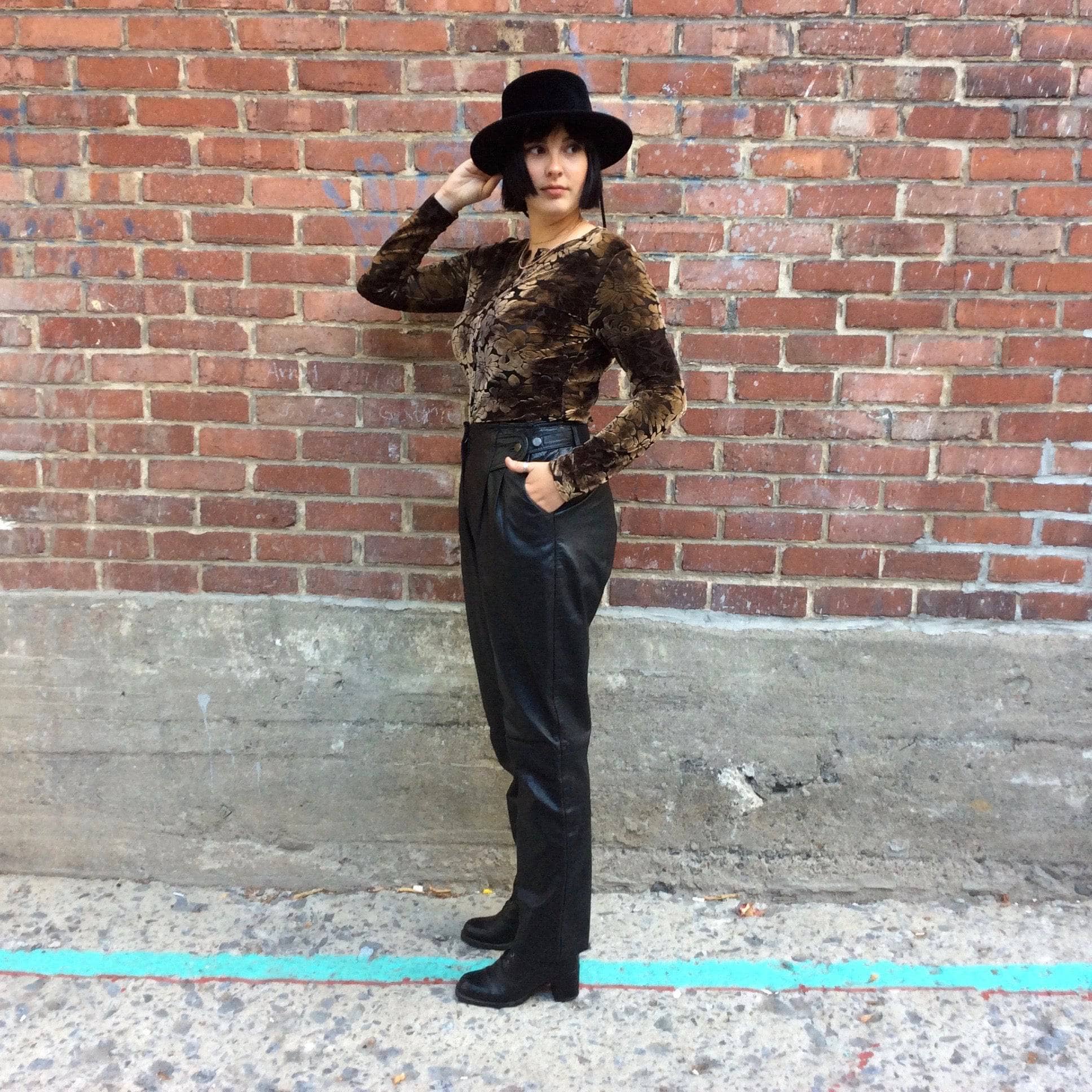 Side View of 1980s High Waisted Black Genuine Leather Pants, sold by bohemevintage.com Montreal