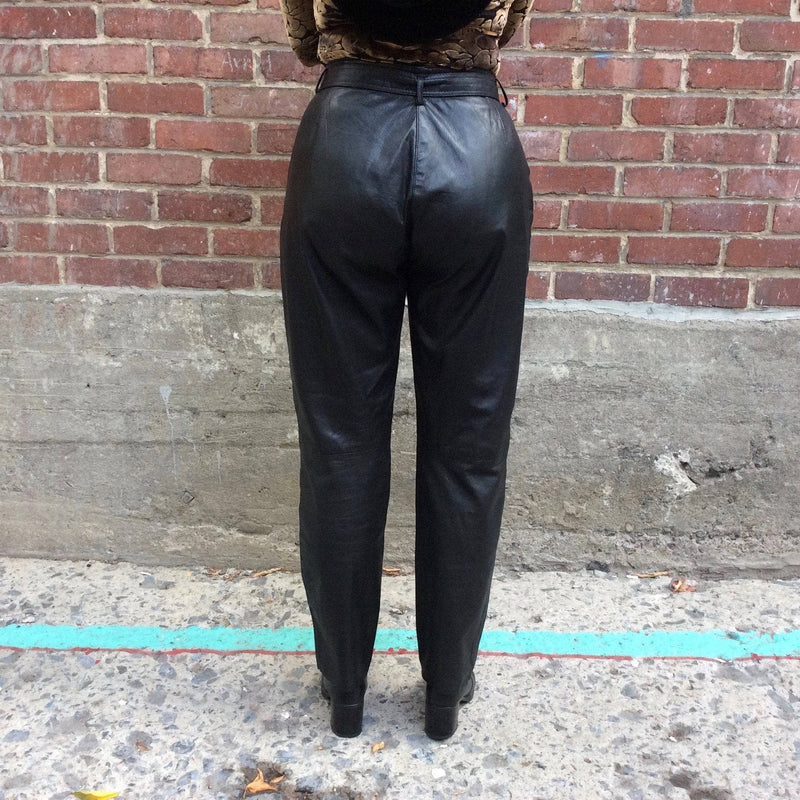 Back View of 1980s High Waisted Black Genuine Leather Pants, sold by bohemevintage.com Montreal