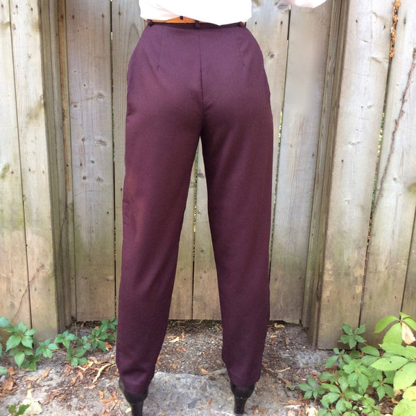 Back view of 1980s Women's High waist Pleated tapered leg burgundy pants size small sold by bohemevintage.com