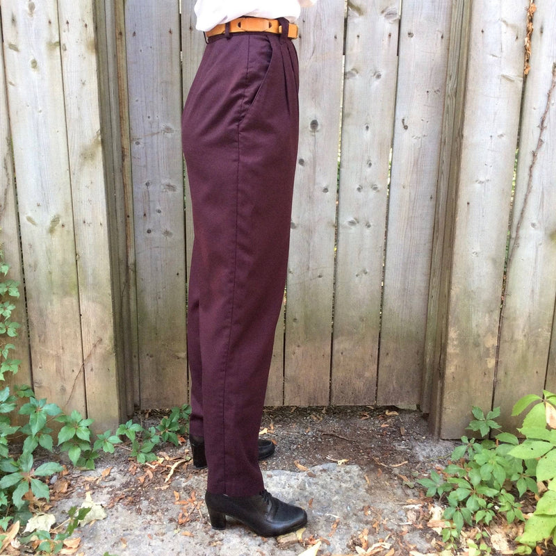 Side view of 1980s Women's High waist Pleated tapered leg burgundy pants size small sold by bohemevintage.com
