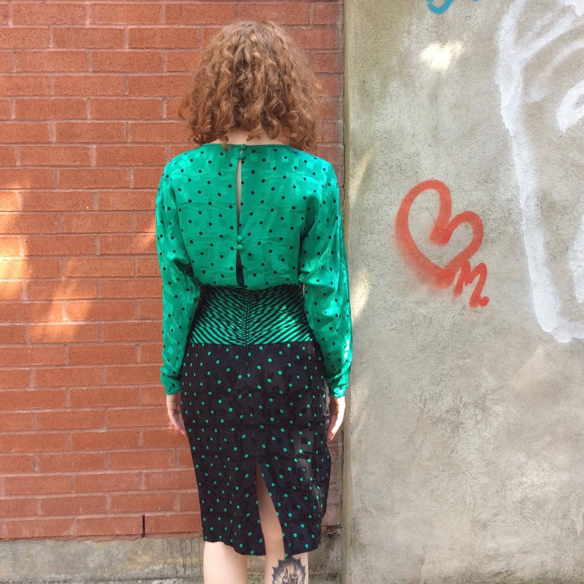 Back view of 1980s Long-Sleeve Polka-Dot Draped Silk Dress, for sale at bohemevintage.com Montréal