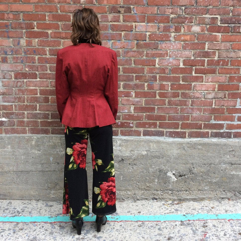 Back view of 1980s Red Fitted Houndstooth Blazer Size Small brand Le Château, worn with bold print palazzo pants sold by bohemevintage.com Montreal