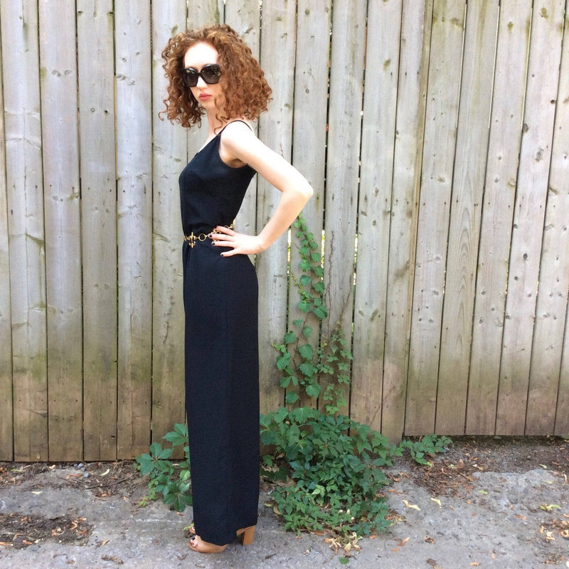 Side View of Sleeveless black jumpsuit sold at bohemevintage.com Montreal