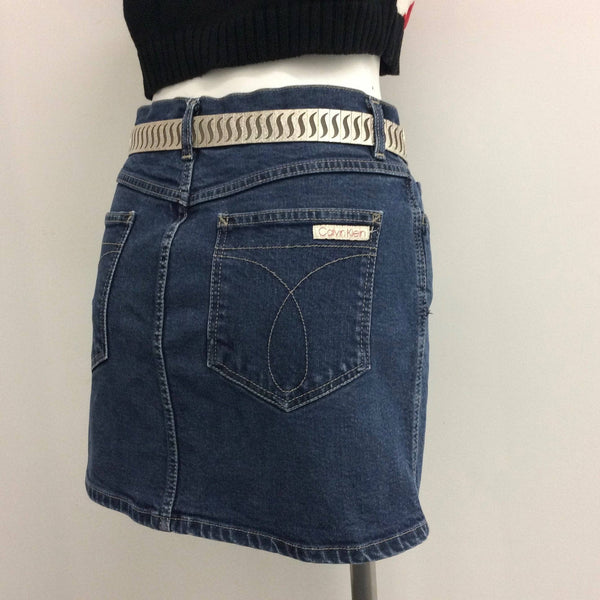 Back View of 1990s Calvin Klein Medium Rise Denim Mini Skirt, Size Small, sold by bohemevintage.com Montreal