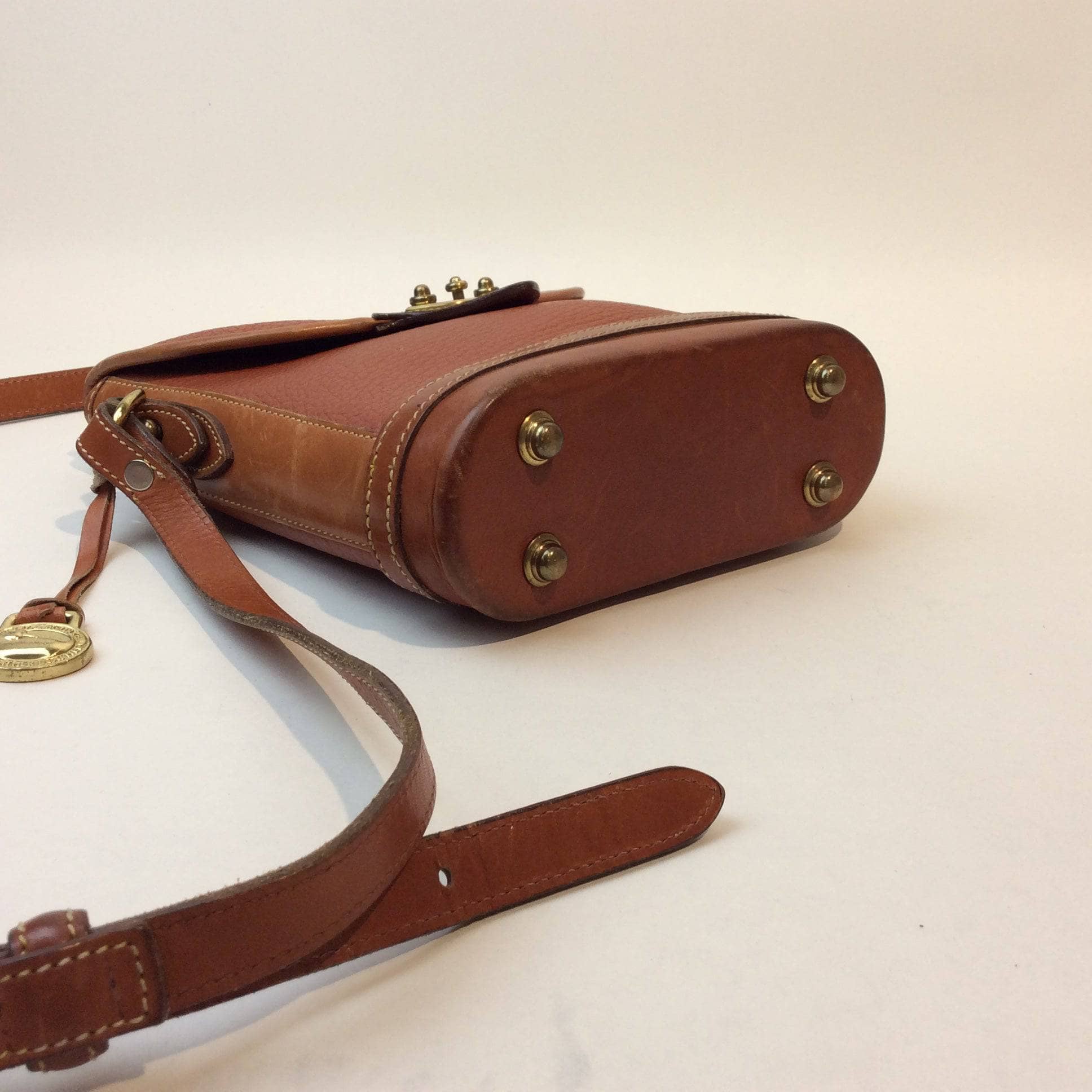 1990s Dooney & Bourke Tan Leather Crossbody Bag. Sold by bohemevintage.com