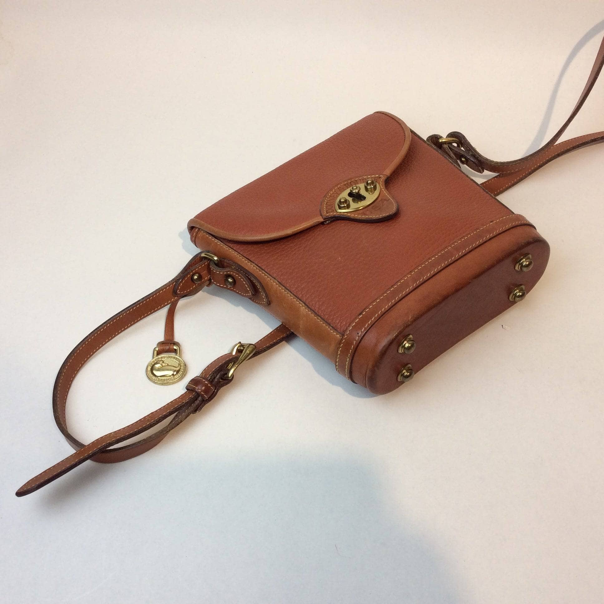1990s Dooney & Bourke Tan Leather Crossbody Bag. Sold by bohemevintage.com