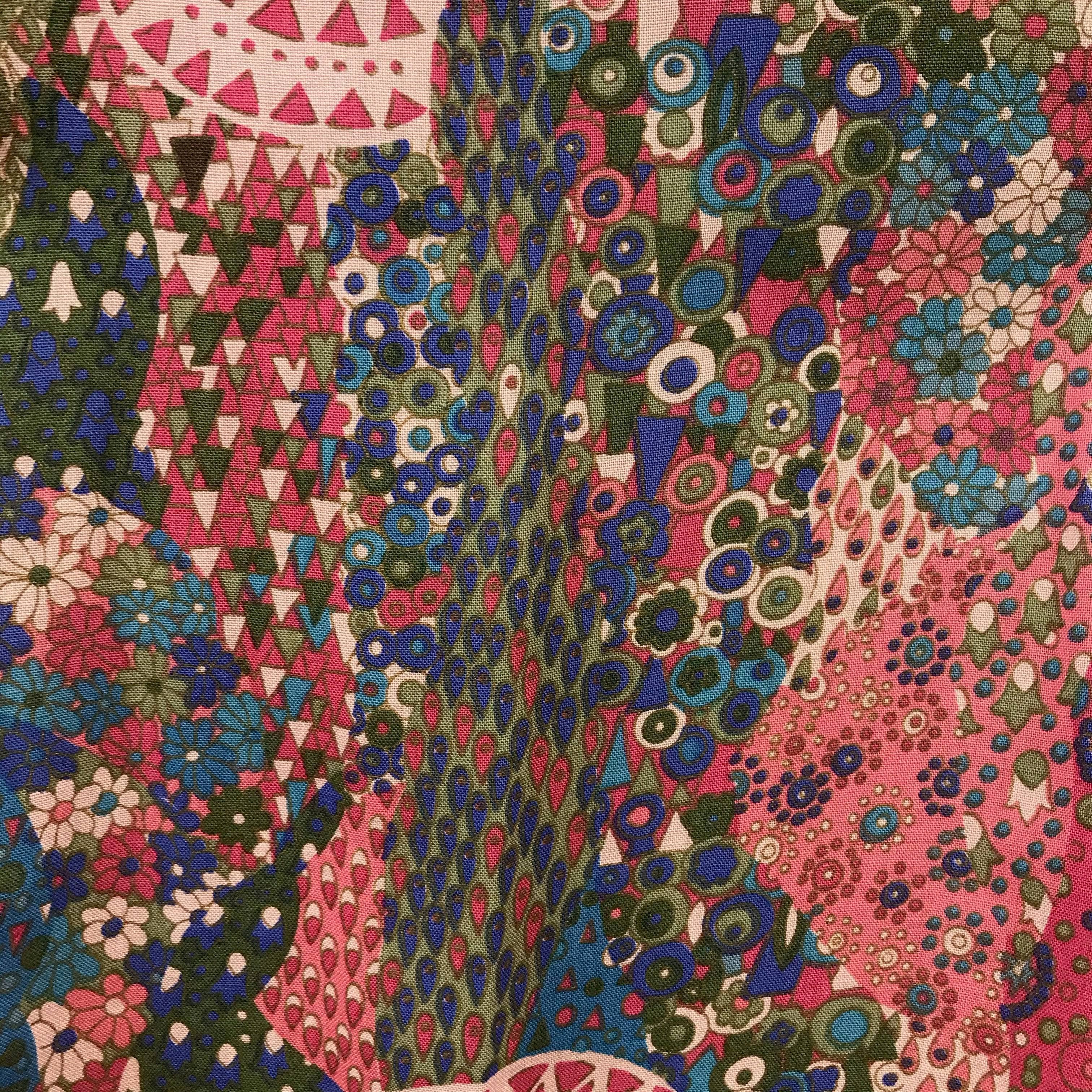 Close-up view of fabric of 1990s Geiger Midi Length Foulard Print Pleated Midi Skirt Size small, sold by Bohemevintage.com