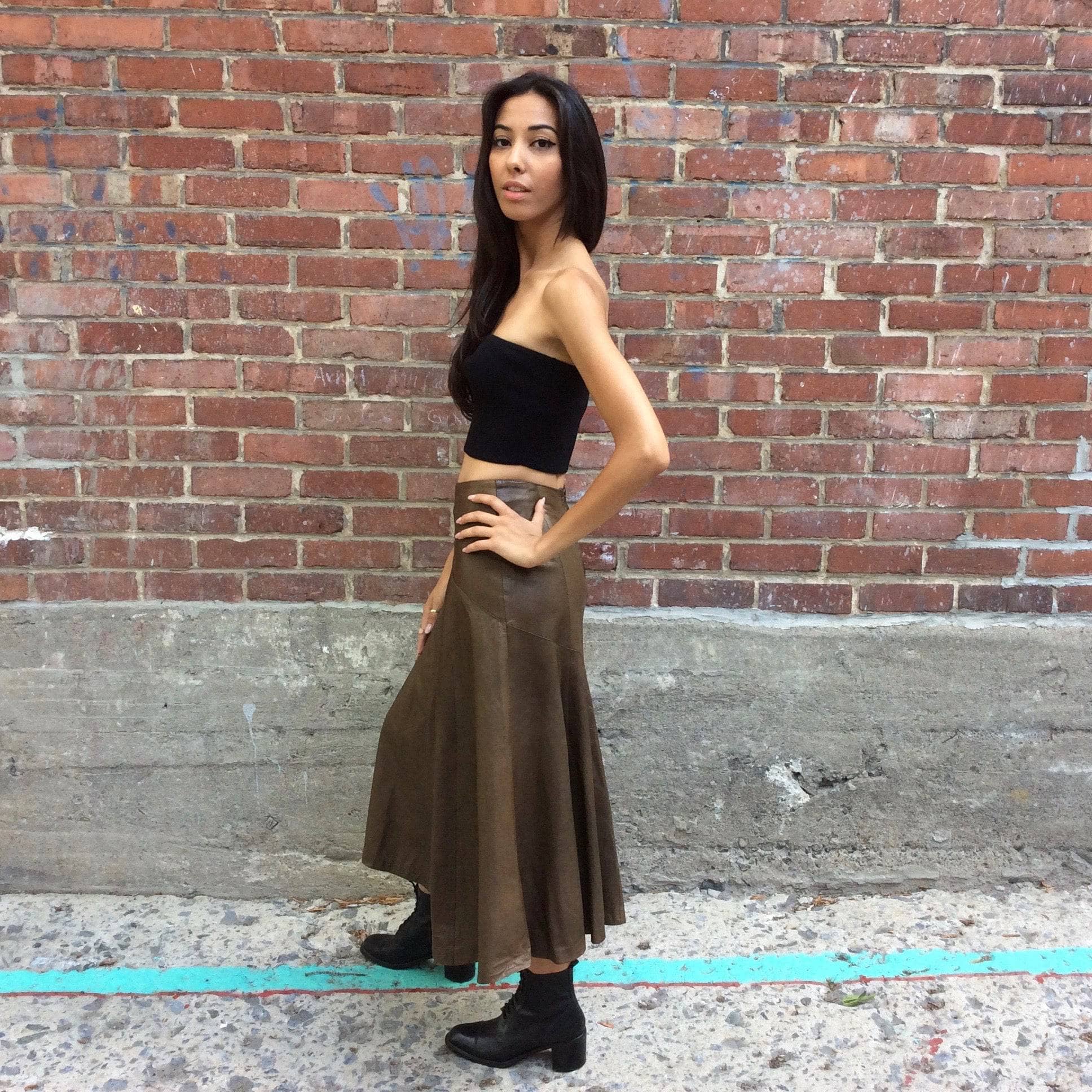 Side view Lily Simon 1990s Midi Length Flared Leather Skirt size Small sold by bohemevintage.com