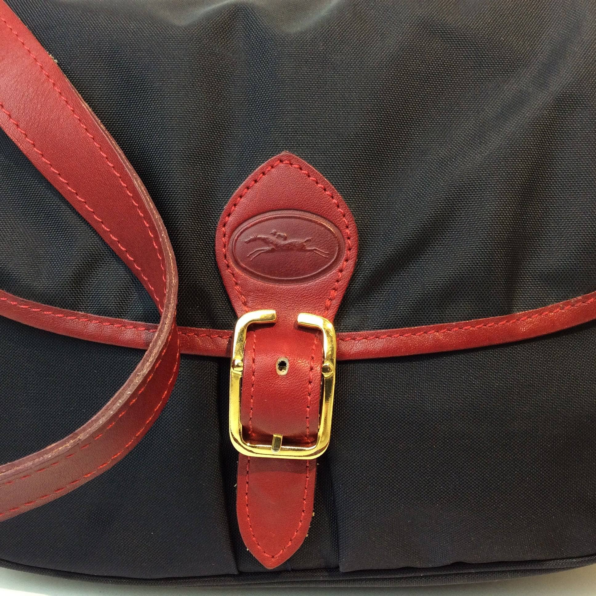 1990s | Designer Medium Navy Messenger Shoulder Bag | Longchamp PARIS. Sold by bohemevintage.com