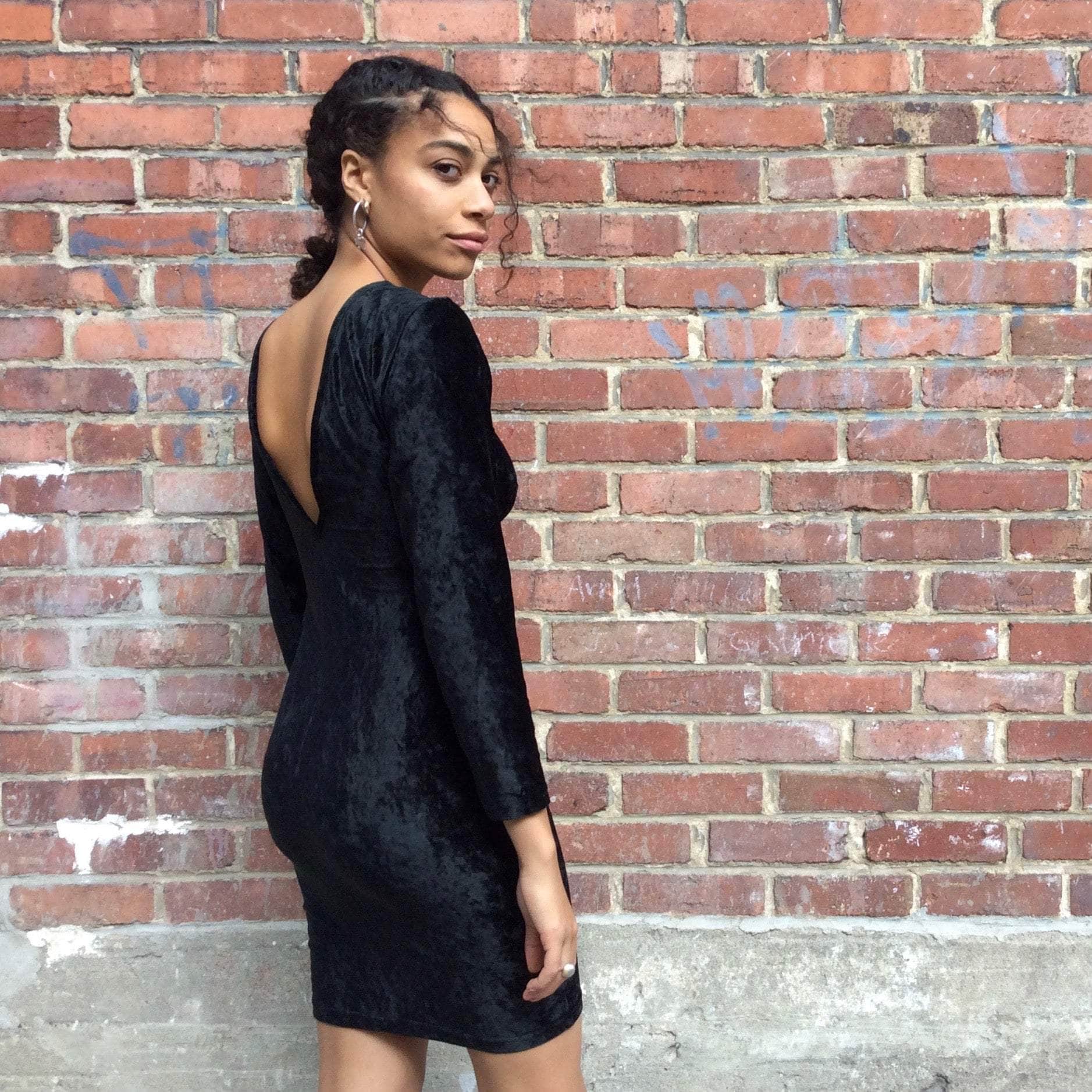 Side BackVi ew of 1990s Open Back Black Velvet Bodycon Mini Dress Size Small sold at bohemevintage.com Montreal