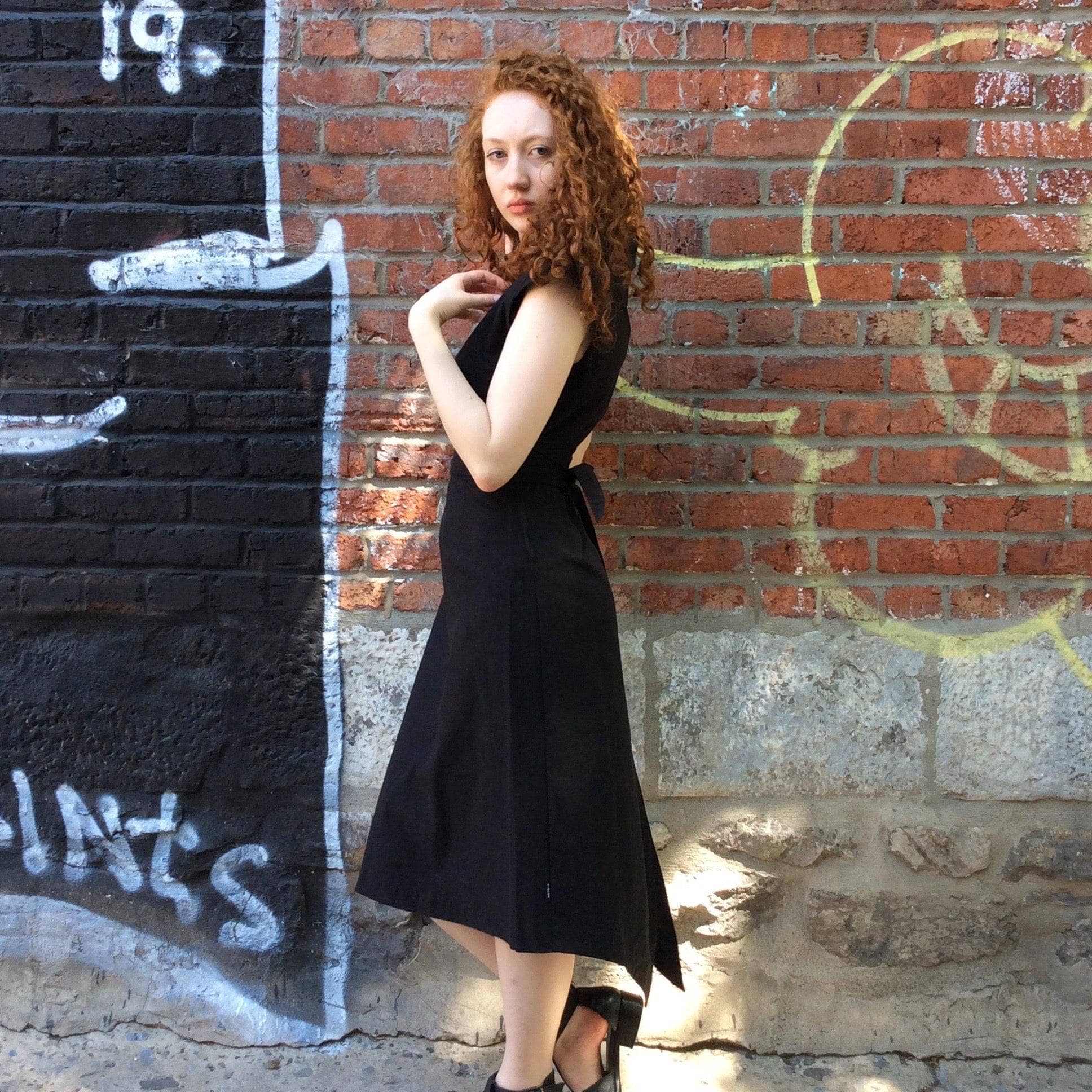 Side View of 2000s "Kitchen ORANGE" Black sleeveless cocktail dress size Small/Medium, sold by bohemevintage.com Montreal