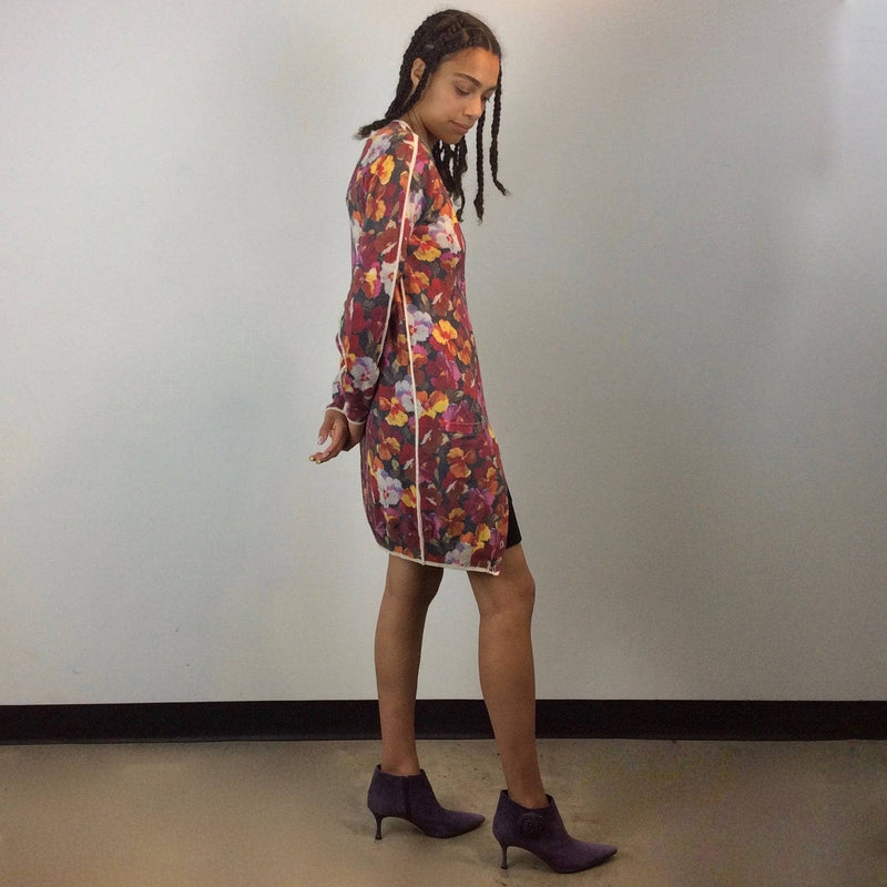 Side view of Long Floral Pansy Print fine wool Cardigan from Designer Dolce & Gabbana size small Medium with Manolo Blahnik purple suede ankle boots sold by bohemevintage.com Montreal
