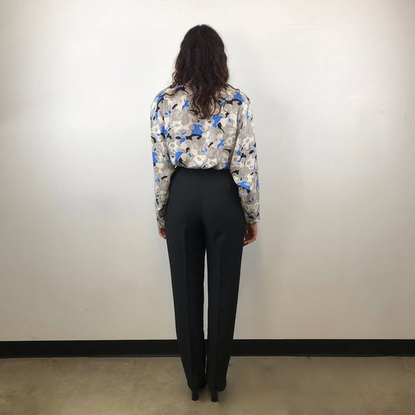 Back view of Emanuel Ungaro High-Waisted Tapered Leg Black Trousers size Medium paired with tucked in Guy Laroche french designer silk blouse sold by bohemevintage.com Montreal