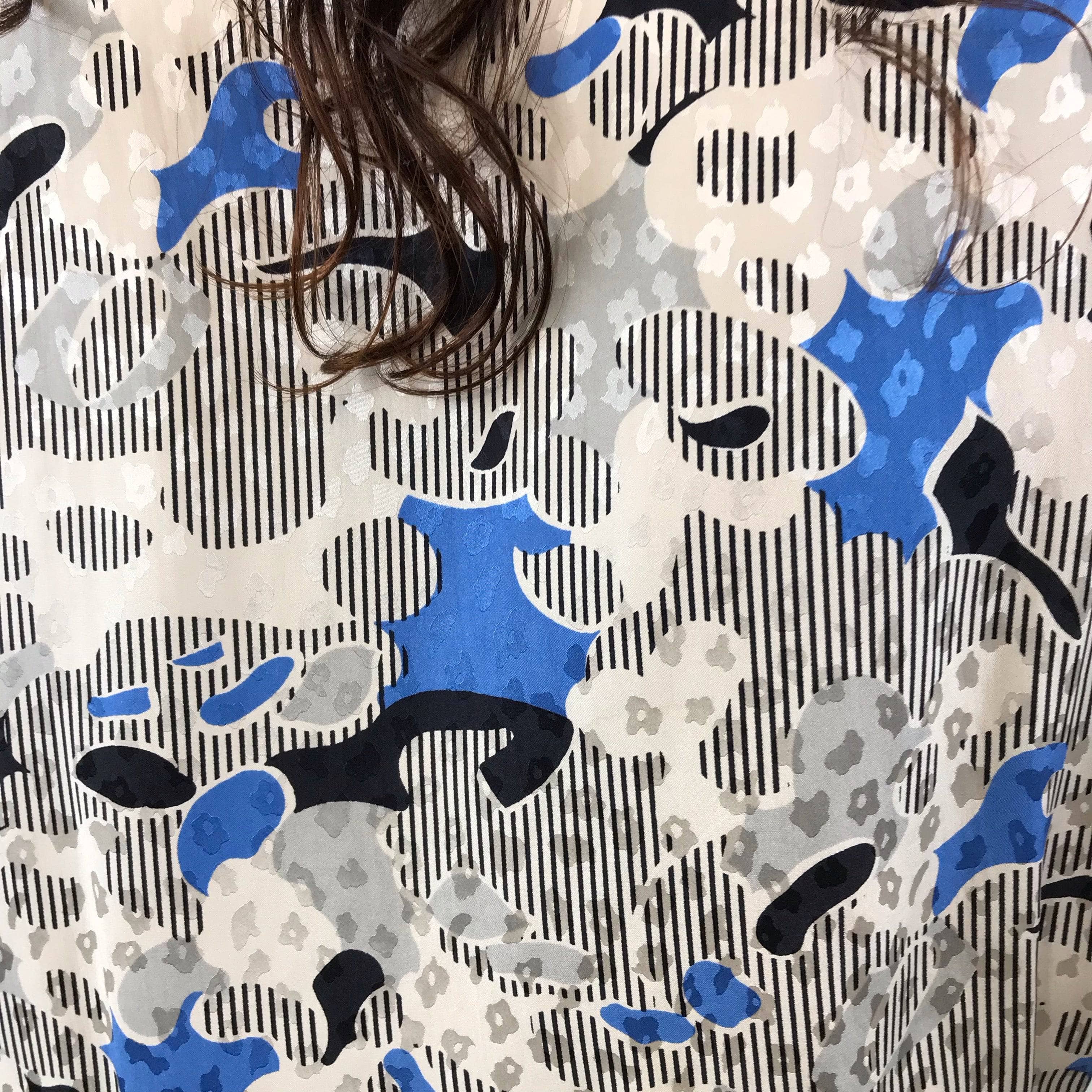 Close-up of silk fabric of Louis Féraud Wrap Silk Peplum Tunic Blouse size Medium-Large sold by bohemevintage.com