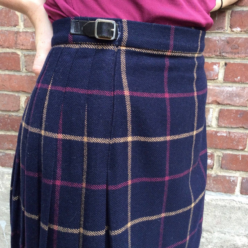 Close-up view of Midi-Length Pleated Tartan Wool Skirt Size S-M sold by bohemevintage.com
