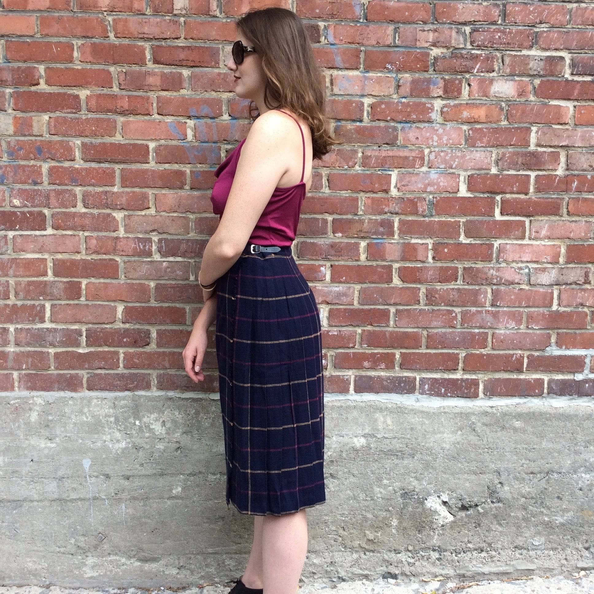 Side view of Midi-Length Pleated Tartan Wool Skirt Size S-M sold by bohemevintage.com