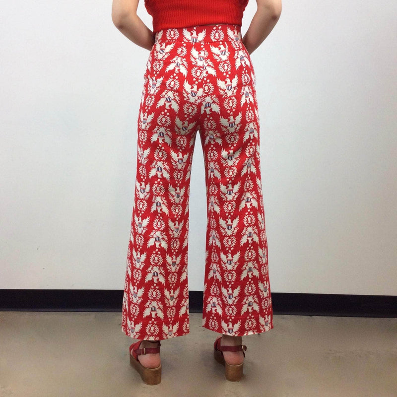 Back view of 1970s Handmade High-Waist Wide Leg eagle print pants size small-medium sold by Boheme Vintage Montreal