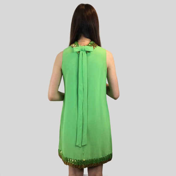 Back view of 1960s Lime Green Petite Shift Mini Dress Size Small/Medium sold at bohemevintage.com Montreal
