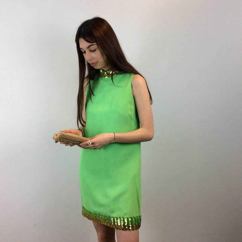 Front view of 1960s Lime Green Petite Shift Mini Dress Size Small/Medium sold at bohemevintage.com Montreal