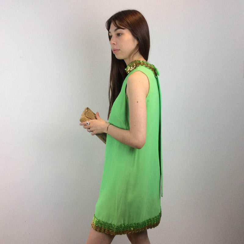 Side view of 1960s Lime Green Petite Shift Mini Dress Size Small/Medium sold at bohemevintage.com Montreal