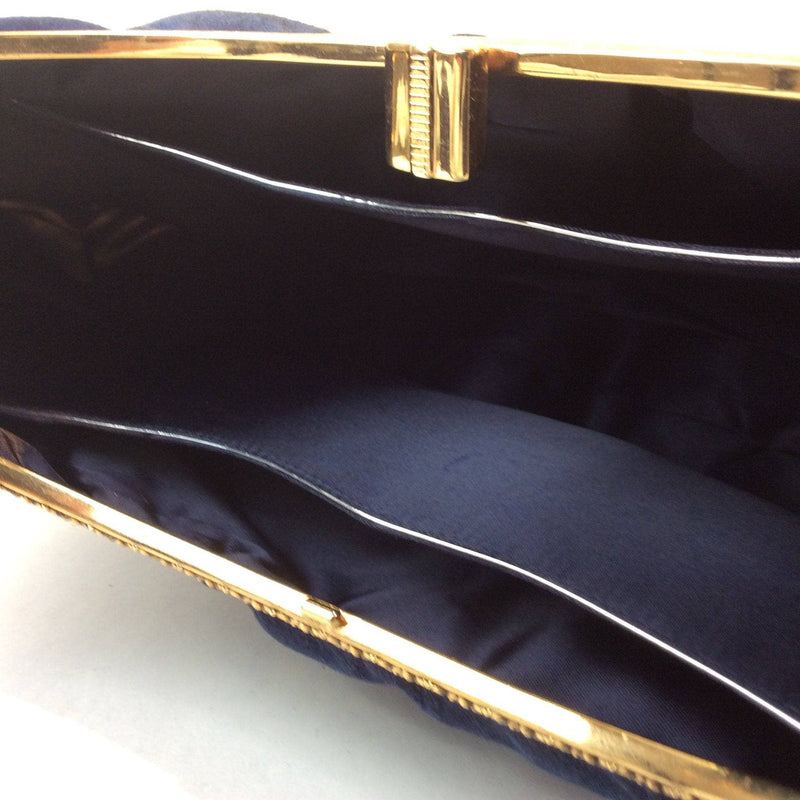 Inside View of Blue Suede Crescent Handbag with Detailed Gold Frame Sold at bohemevintage.com Montréal