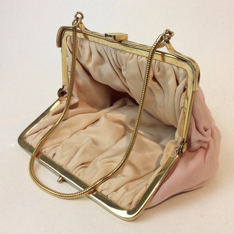 Inside View of 1950s Light Pink Silk Crepe Evening Bag. Sold at bohemevintage.com Montreal
